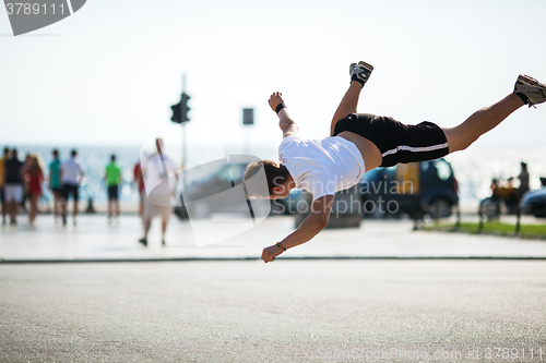 Image of Urban acrobatics with somersault