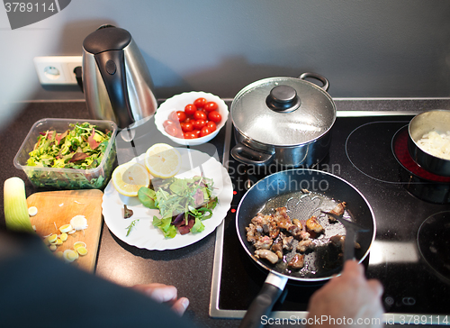 Image of Cooking tasty family dinner at home