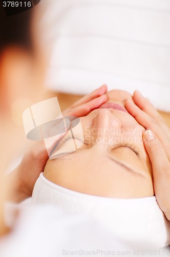 Image of Woman under facial spa procedure