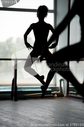 Image of Two ballet dancers doing jumps