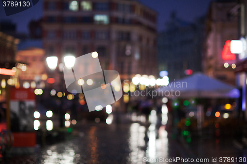 Image of Blurred cityscape on a rainy evening