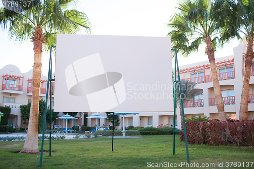 Image of Blank billboard with tropical palm trees