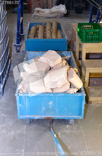 Image of Truck with soap and water at the plant for the production of soa