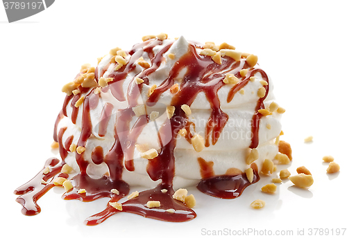 Image of whipped cream with chocolate sauce and peanuts