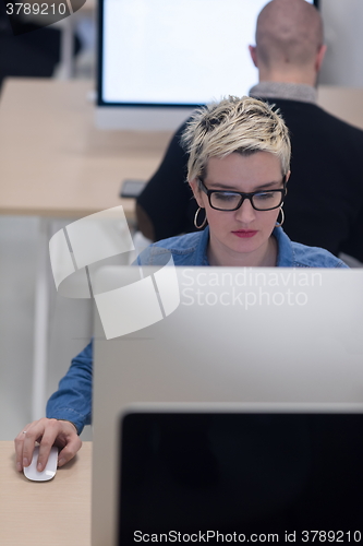 Image of startup business, woman  working on desktop computer