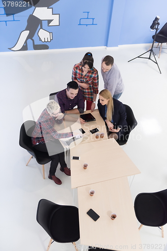 Image of aerial view of business people group on meeting