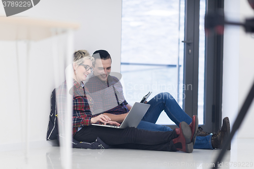 Image of startup business, couple working on laptop computer at office