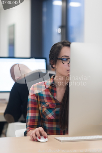 Image of startup business, woman  working on desktop computer