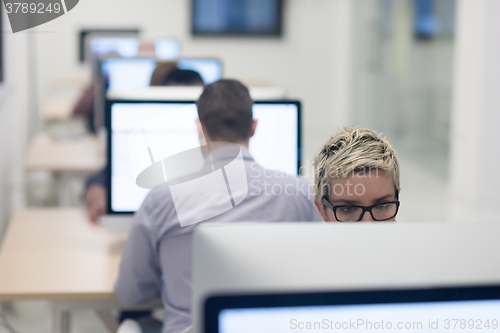 Image of startup business, woman  working on desktop computer