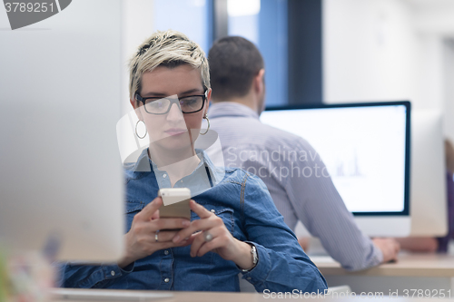 Image of startup business, woman  working on desktop computer