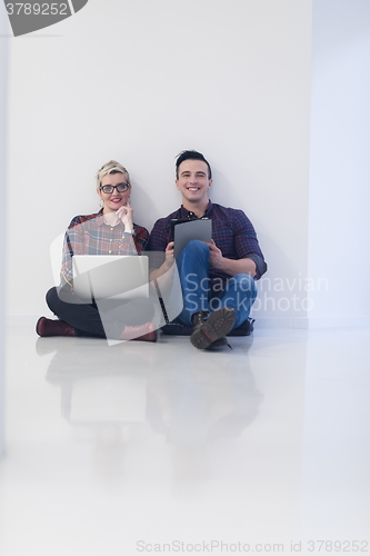 Image of startup business, couple working on laptop computer at office