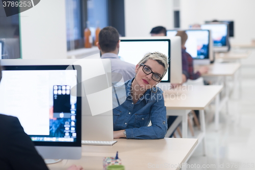 Image of startup business, woman  working on desktop computer