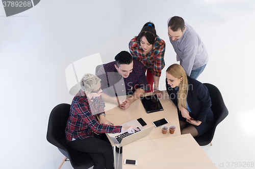 Image of aerial view of business people group on meeting