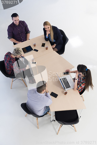 Image of aerial view of business people group on meeting