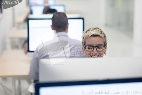 Image of startup business, woman  working on desktop computer