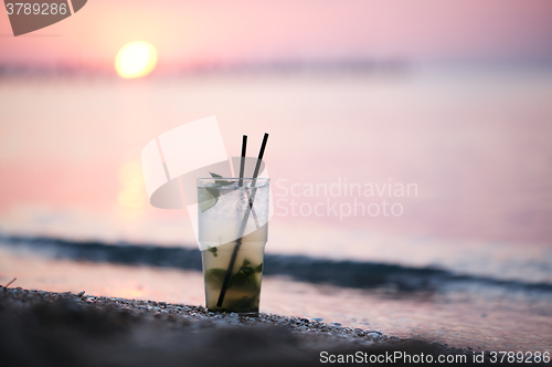 Image of Mojito cocktail at the seashore