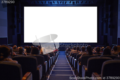 Image of White cinema screen with audience. 