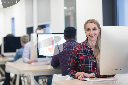 Image of startup business, woman  working on desktop computer