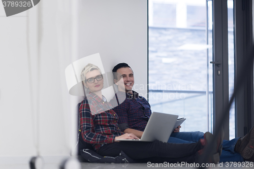 Image of startup business, couple working on laptop computer at office