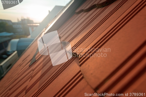 Image of Roof tile over blue sky