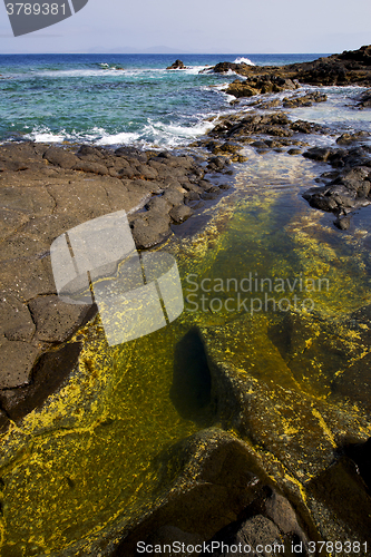 Image of froth coastline in lanzarote spain  rock stone sky cloud    and 