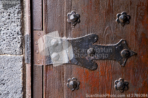 Image of castle lock spain knocker  abstract r wood in the red brown 