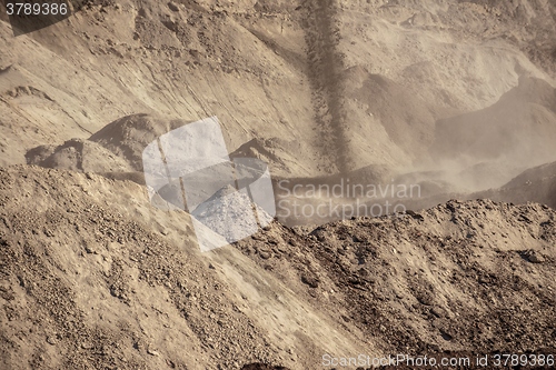 Image of Large excavation site with heaps of sand