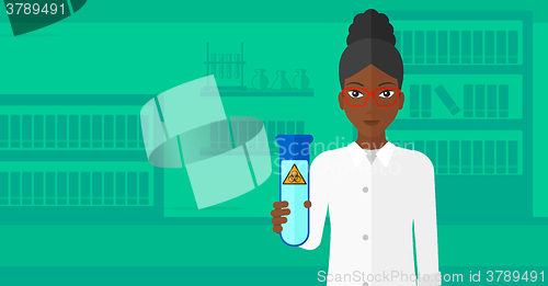 Image of Laboratory assistant with test tube.