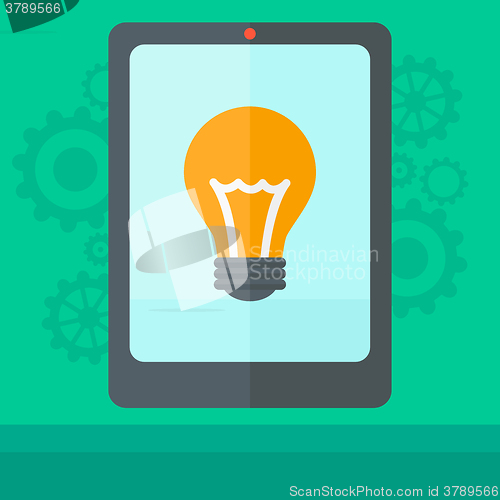 Image of Background of digital tablet with lightbulb.