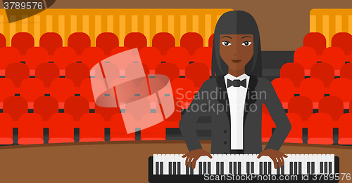 Image of Woman playing piano.