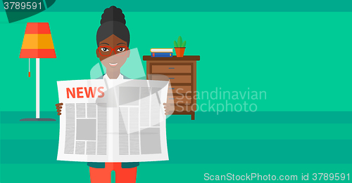 Image of Reporter reading newspaper.