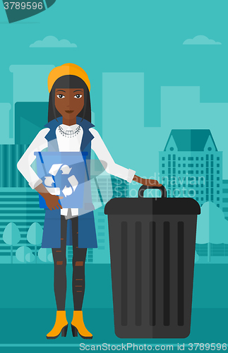 Image of Woman with recycle bins.