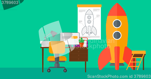 Image of Background of workspace with business start-up rocket.