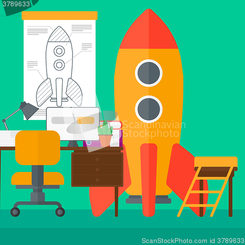 Image of Background of workspace with business start-up rocket.