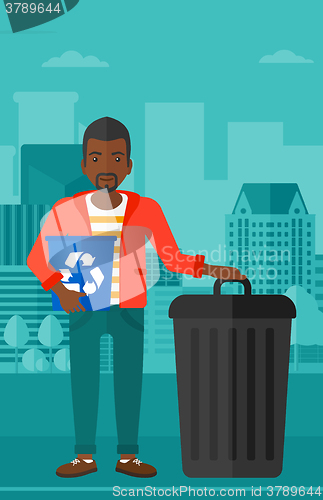 Image of Man with recycle bins.