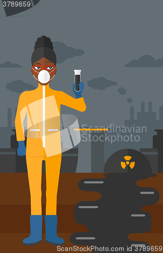 Image of Laboratory assistant with test tube.