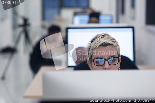 Image of startup business, woman  working on desktop computer