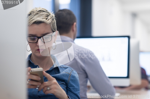 Image of startup business, woman  working on desktop computer