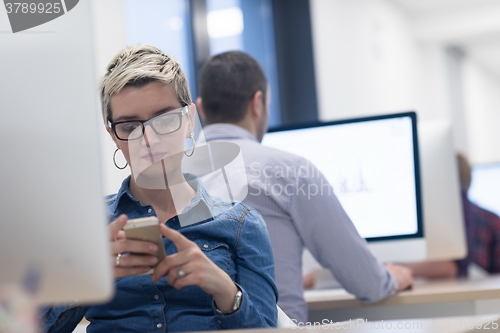 Image of startup business, woman  working on desktop computer