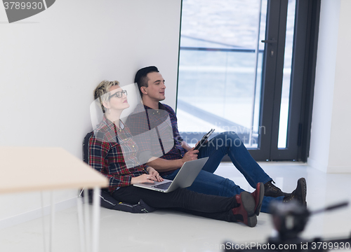 Image of startup business, couple working on laptop computer at office