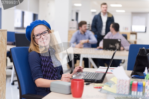 Image of startup business, woman  working on laptop