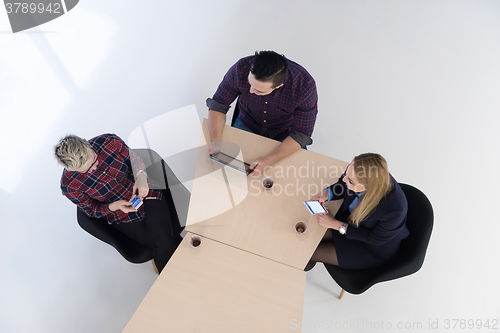 Image of aerial view of business people group on meeting