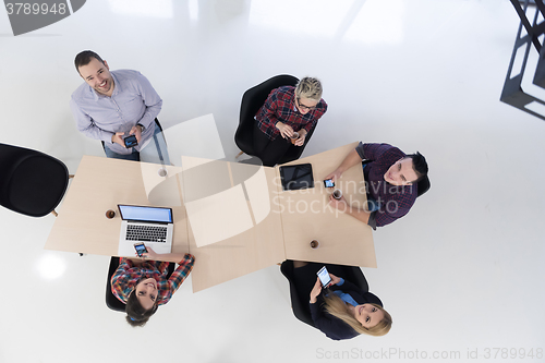 Image of aerial view of business people group on meeting