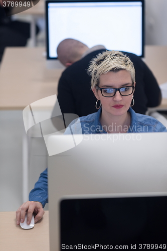 Image of startup business, woman  working on desktop computer