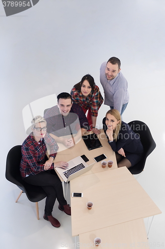 Image of aerial view of business people group on meeting