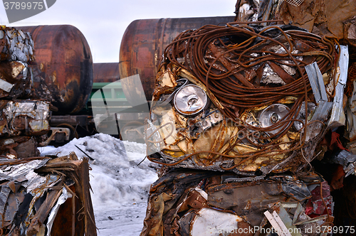 Image of A pile of compressed cars in blocks for processing