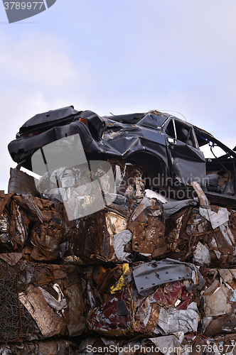 Image of A pile of compressed cars in blocks for processing