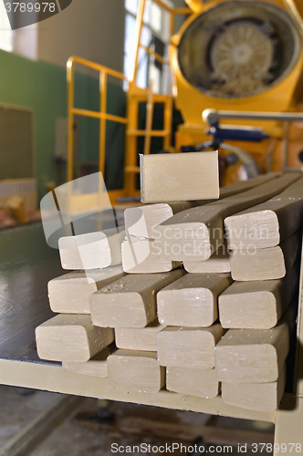 Image of Pieces of soap on a conveyor belt