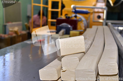 Image of Pieces of soap on a conveyor belt