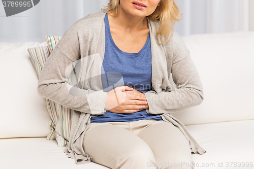 Image of close up of woman suffering from stomach ache